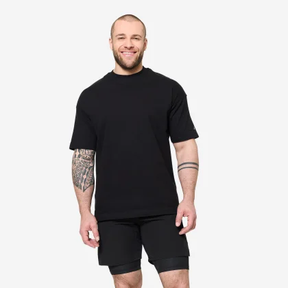 DOMYOS Pánske voľné fitness tričko čierne M