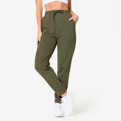 DOMYOS Dámske fitness tepláky 500 Essentials rovné zelené XS (W26 L30)