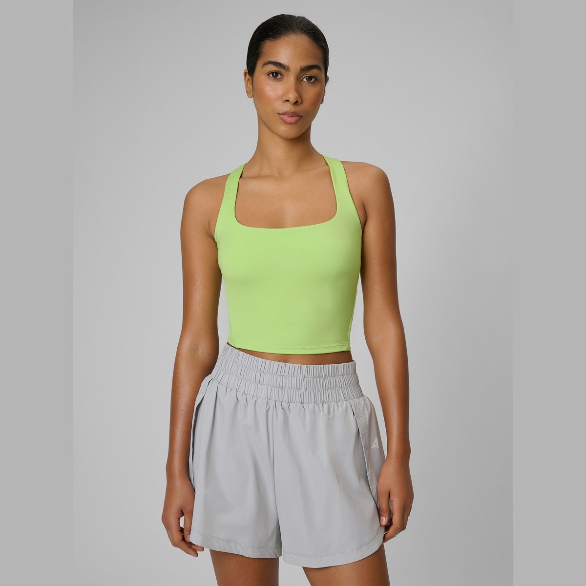 Crop top tréningový slim rýchloschnúci dámsky - zelený · záber 1
