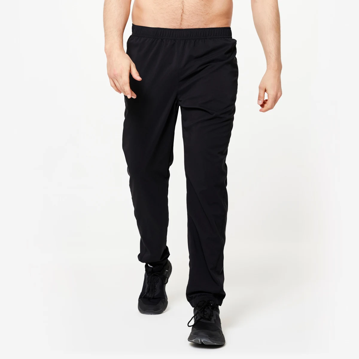 DOMYOS Pánske priedušné fitness tepláky čierne M (W32 L33) · záber 1