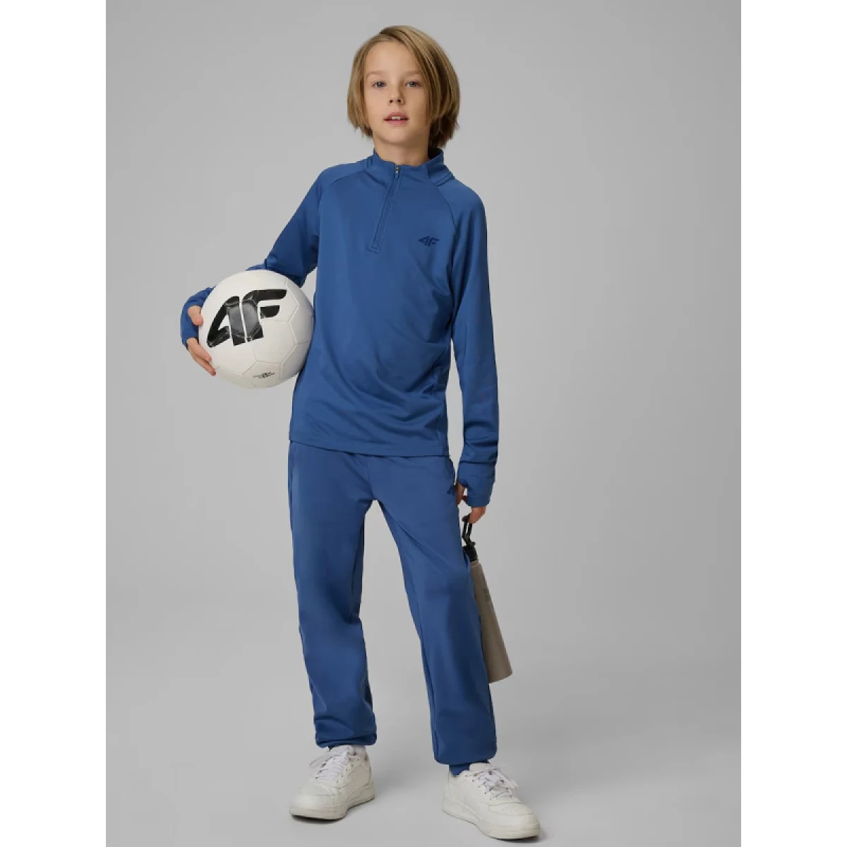 Chlapčenské tréningové tepláky 4F JUNIOR TROUSERS FNK M1152-31S-NAVY · záber 4
