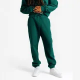 DECATHLON Pánske oversize tepláky Elementals zelené M(W32 L33) · záber 1