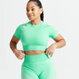 DOMYOS Dámsky crop top 900 na fitness bezšvový s krátkym rukávom zelený XS · záber 1