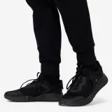 DOMYOS Pánske slim tepláky na cvičenie čierne S (W30 L33) · záber 2